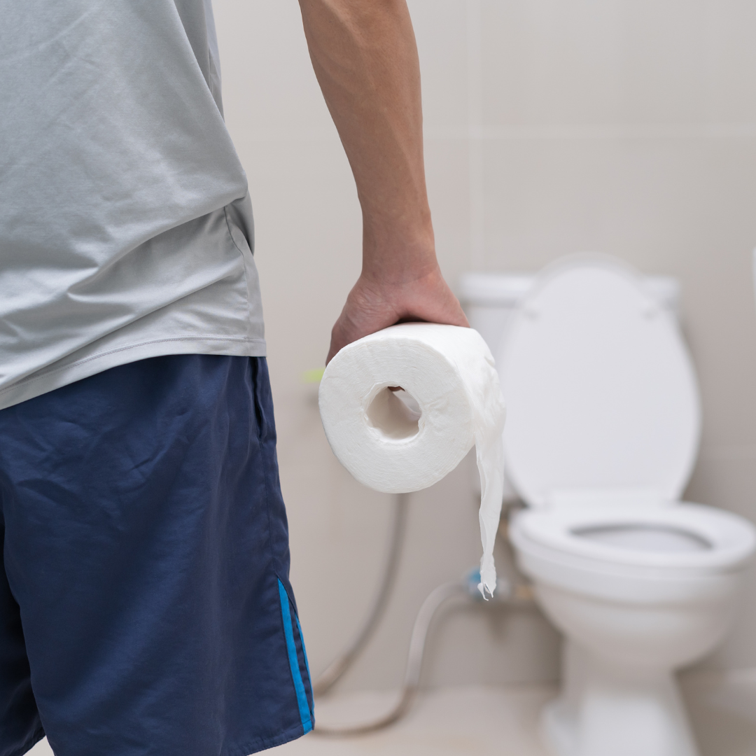 Illustration of a person experiencing constipation, holding their stomach, with icons of fiber-rich foods and a glass of water to represent natural remedies."